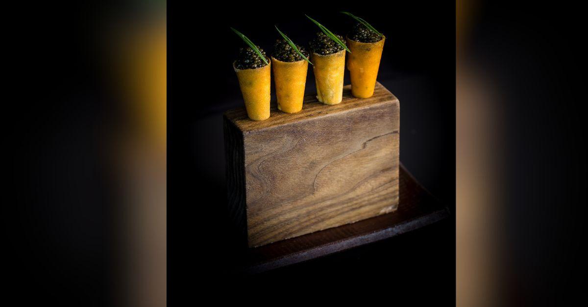 image of The Spicy Tuna Cones topped with caviar and gold leaf is not to be missed! 