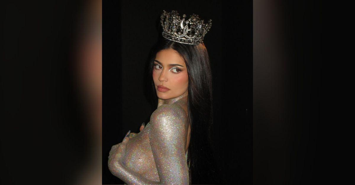 image of Kylie Jenner posed in nothing but body glitter for her 'King Kylie' collection promo shoot. 