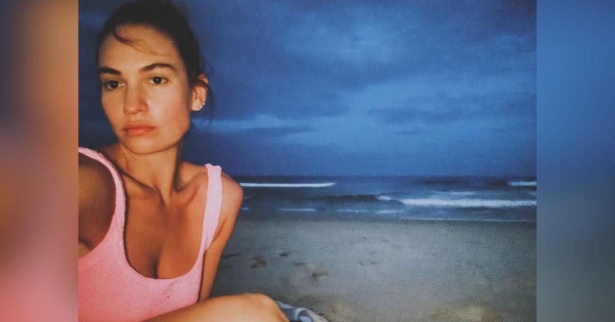 Image of Lily James enjoyed time on the beach at night in Australia.