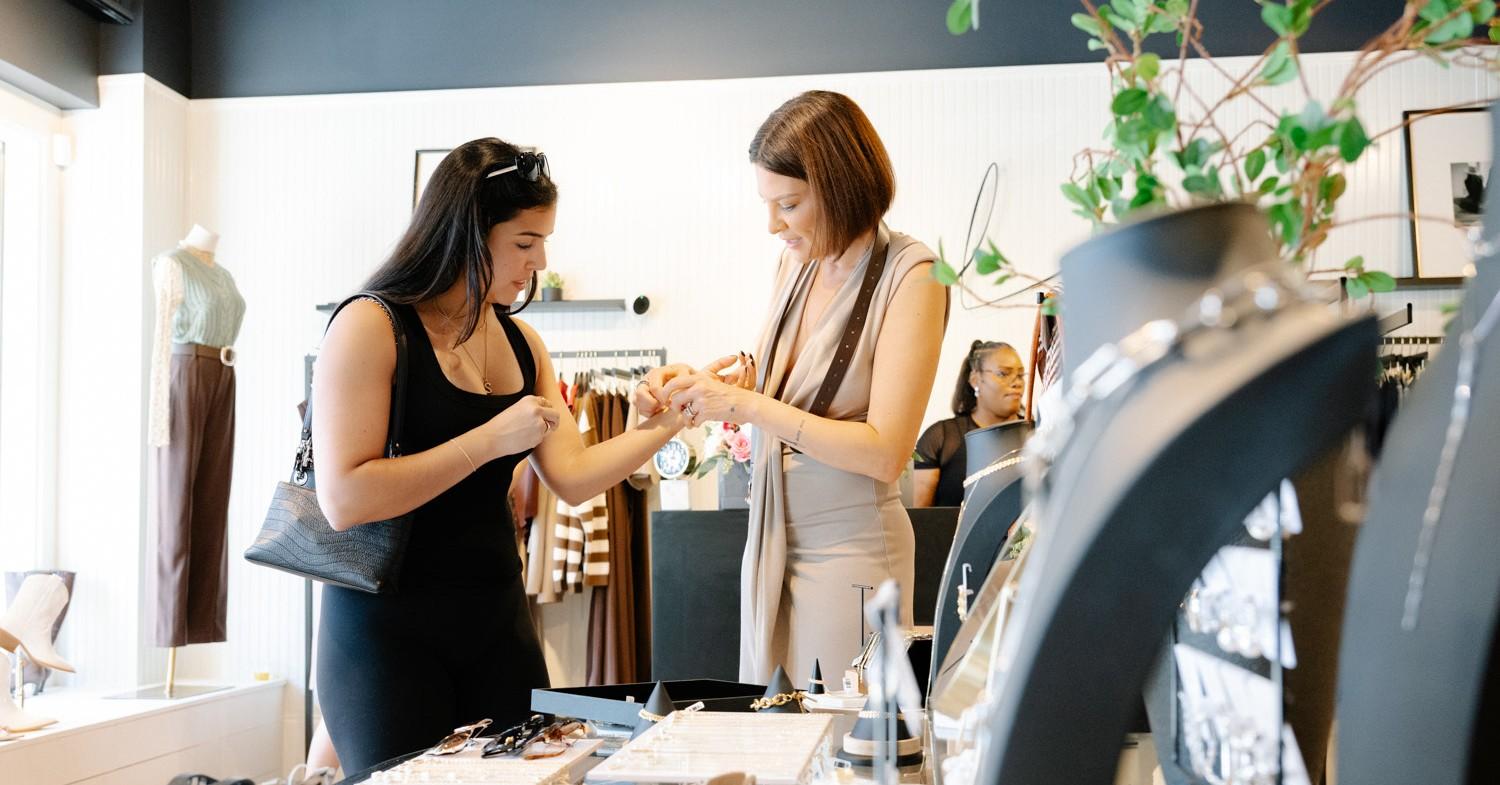 Photo of Lindsay Rose Rando and a customer. 