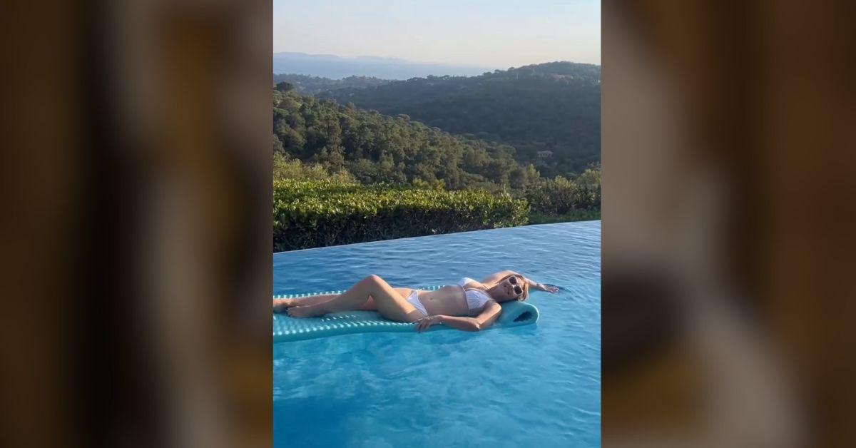 image of 'Floating in heaven,' Hurley captioned her sun-kissed clip.